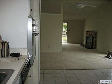 Kitchen looking into dining room into living room.