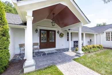 Wonderful front portico was added to make a beauti