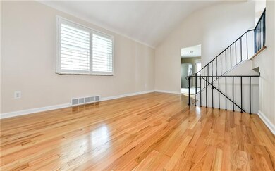 Oversized dining room with gleaming hardwood floor