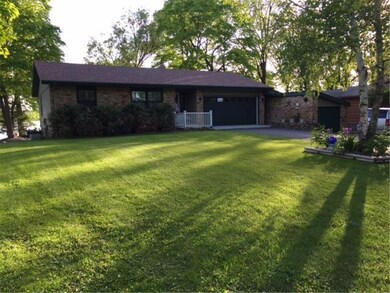 Road side view of house with newer roof, windows, 