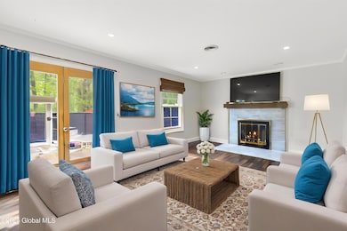 Family room w/gas FP virtually staged