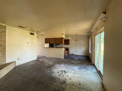 Unfurnished living room featuring unfinished concr