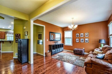 Beautiful red oak hardwood flooring covers the flo