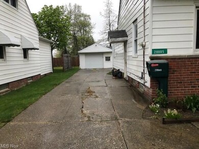 Driveway leading to a 2 car garage