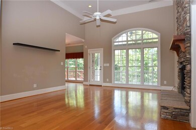 Living room opens to screened porch.