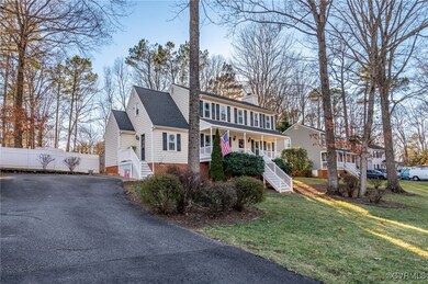 View of front of property with fence, stairway, a