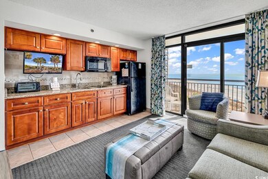 Living room featuring light tile patterned floors,