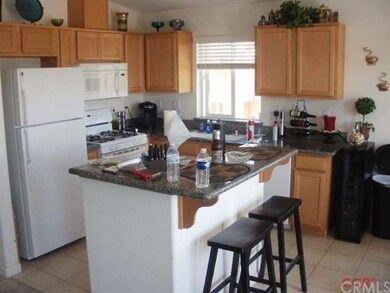 Kitchen with granite counters and a little breakfa
