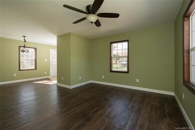 Living room and breakfast nook leading to kitchen