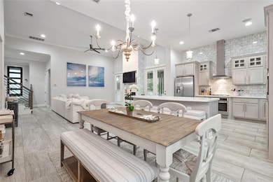 Dining area featuring a chandelier, recessed ligh