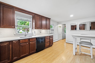 Renovated kitchen with quartz countertops.