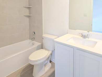 Full bath featuring vanity and shower / washtub combination