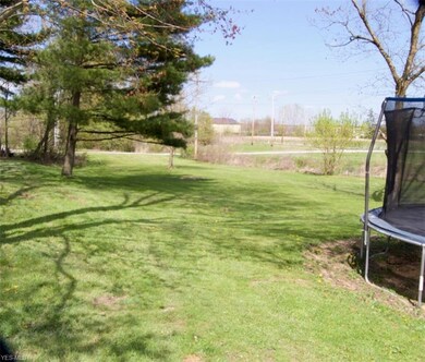 Private backyard. (Standing at garage, looking tow