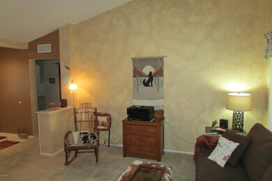 Living Room has Vaulted Ceiling