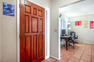 Spacious foyer and beautiful wood door