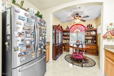 Kitchen with freestanding refrigerator, ceiling fa