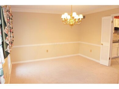 Lovely dining room is embellished with a dazzling 