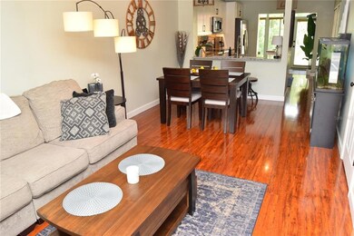 The Living Room/Dining Room Combo and beautiful laminate flooring.