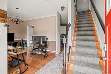 Staircase featuring hardwood / wood-style floors,