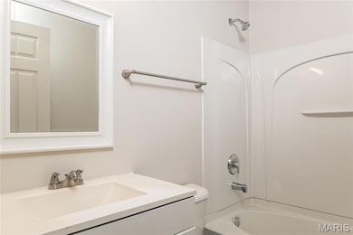 Bathroom featuring bathing tub / shower combination and vanity