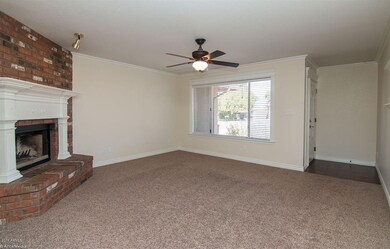 Fireplace w/beautiful mantel and trim