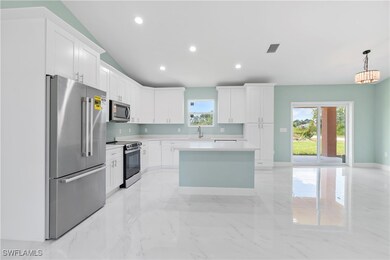 Kitchen with appliances with stainless steel finis