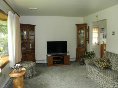 Good-sized living room with hardwood floors under 