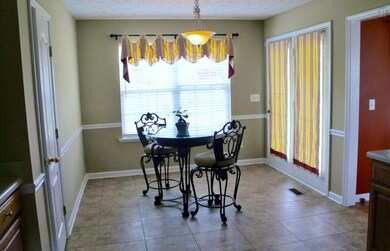 The spacious kitchen's 'eat-in' and french doors to porch.