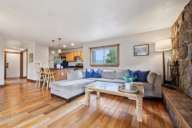 Living room with light wood-style flooring
