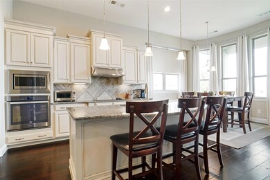 Kitchen with light stone counters, appliances with