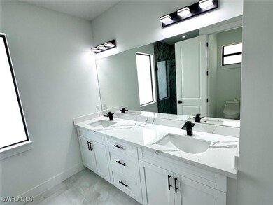 Bathroom featuring marble finish flooring, double