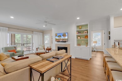 Living room with light hardwood / wood-style floor