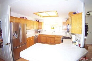 Great kitchen with oak cabinets tile counters and 