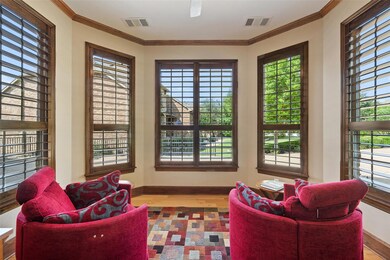 Sitting room featuring wood finished floors, base
