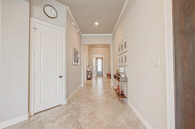 Wide hallway with upgraded large porcelain tiles.