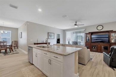 Kitchen into great room with a slight view of dini