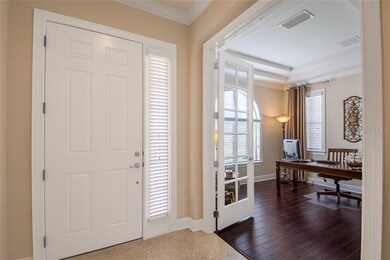 Glass French doors open into a private office or s