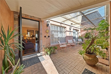 Front entrance with a private patio.