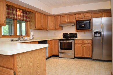 Beautiful Wood Cabinets with New Stainless Steel A