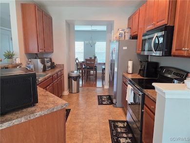 Kitchen with appliances with stainless steel finis