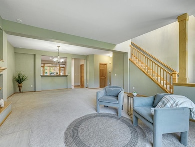 The main level offers an open floor plan highlighted by a cozy gas fireplace in the living room.