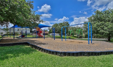 Community park with several swings and shaded play