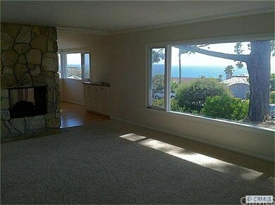 Ocean view living room with fireplace