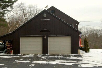 Exterior side showing 2-car Garage.