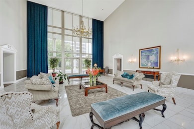 Bright and spacious living area designed with a contemporary open concept and designer furnishings.