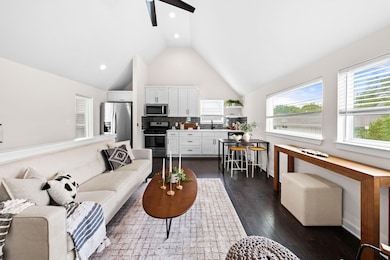 Living room with recessed lighting, a ceiling fan