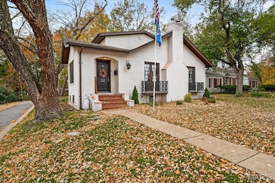 English style cottage style brick home and a chimney features over 2880 sq ft of space.