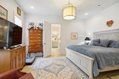 Light-filled primary bedroom with en-suite bathroo