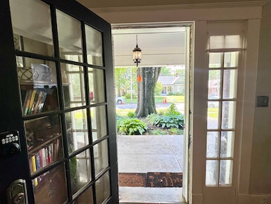 Entryway featuring ornamental molding and healthy amount of natural light