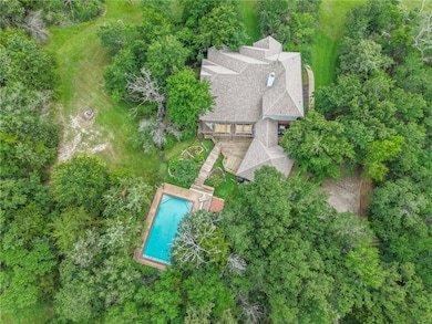 The house is ideally nestled within a grove of mat